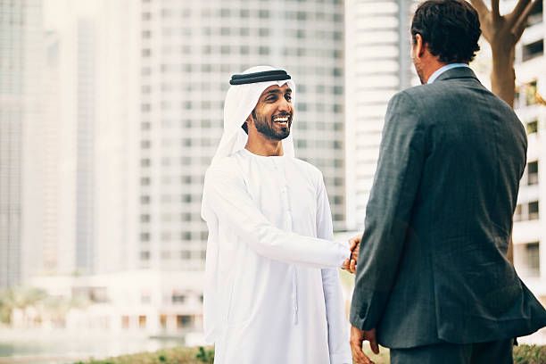 istock Businessmen in Dubai handshake 470189978