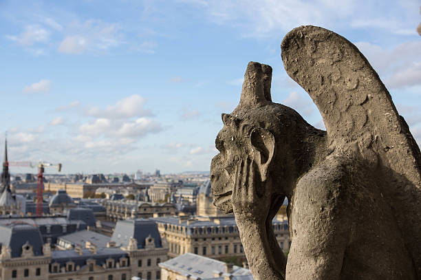 istock Stone gargoyle overlooking Paris from the Notre Dame 470193102