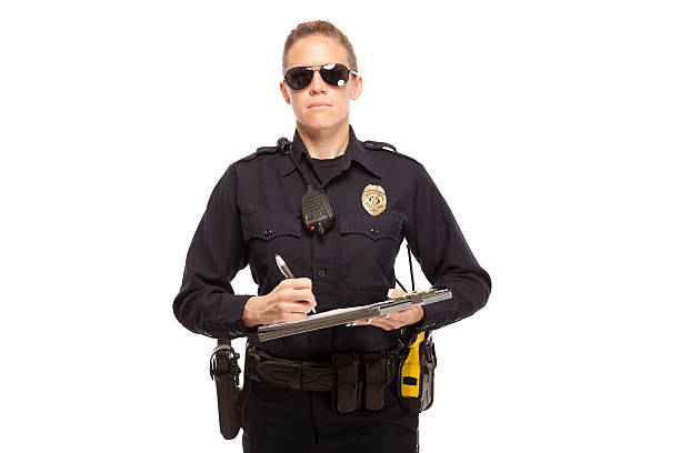 istock Female police officer writing report 470193416