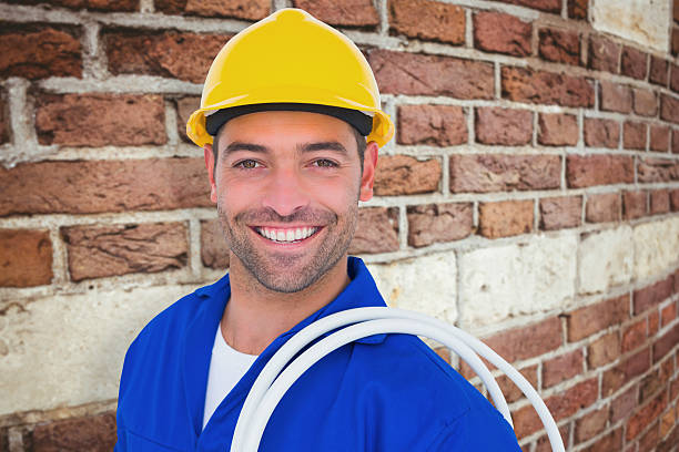 istock Composite image of electrician carrying wires over white background 470193790