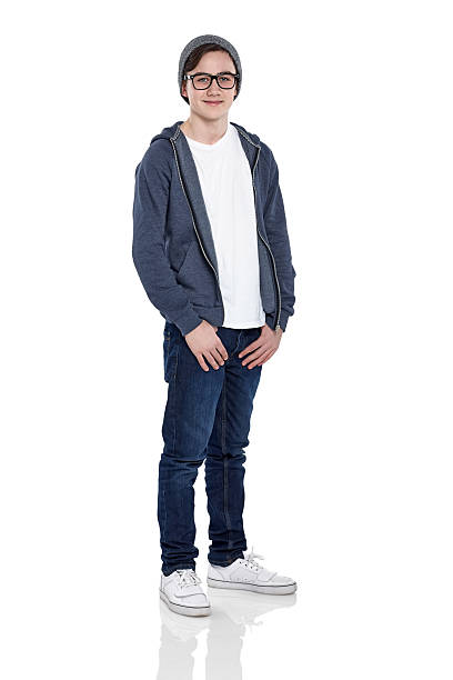 istock Smart young boy wearing glasses and cap posing on white 470193940