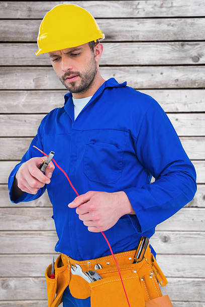 istock Composite image of electrician cutting wire with pliers 470193952