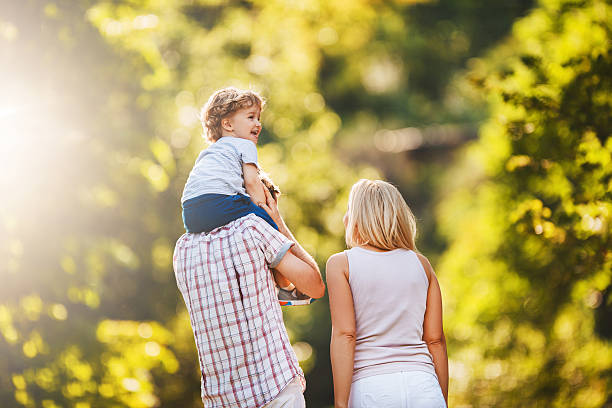 istock Rear view of parents spending a day with their son. 470194064