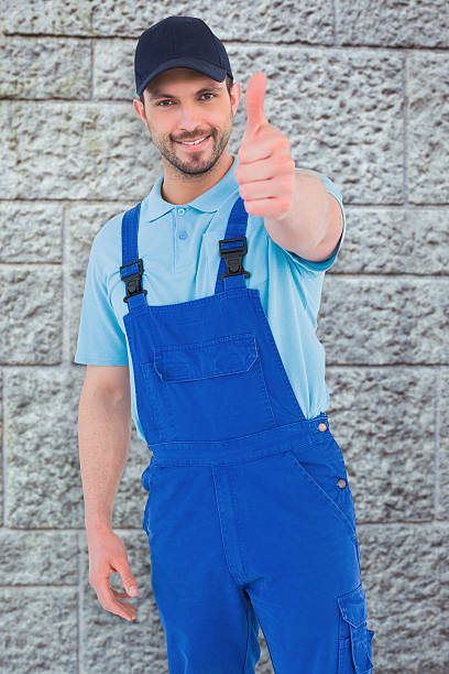 istock Composite image of repairman gesturing thumbs up 470194106