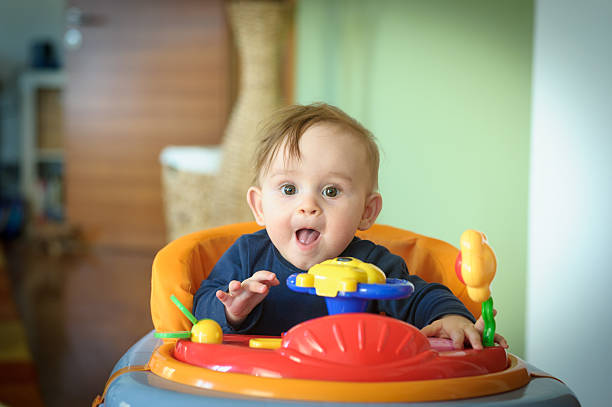 Baby Girl in Walker stock photo