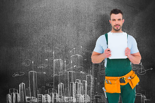 istock Composite image of repairman showing clipboard 470197760