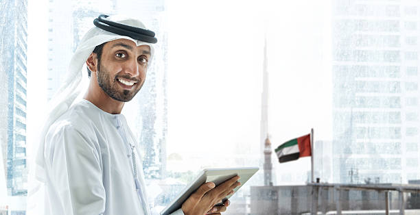 istock Emirati smiling businessmen in Dubai with tablet 470198764