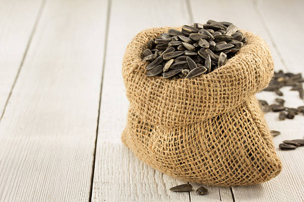 istock sunflower seeds in bag on wood 470200534