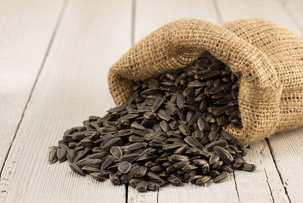 istock sunflower seeds in bag on wood 470200540