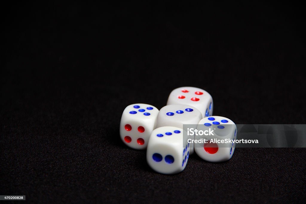 Dice on the black background Dice on the black background, random number 2015 Stock Photo