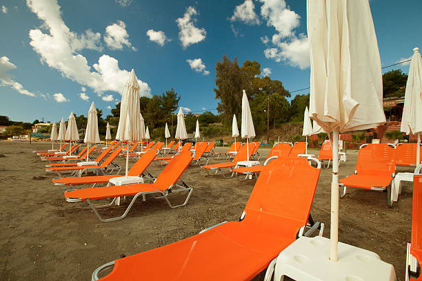 istock sunchairs with  umbrellas on beautiful  beach 470200884