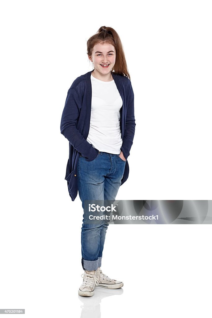 Pretty young girl posing for camera Full length portrait of pretty young girl posing for camera on white background 12-13 Years Stock Photo