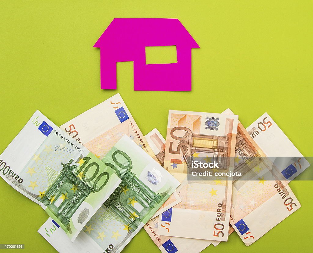 House and euros A house over a pile of euros Bank Account Stock Photo