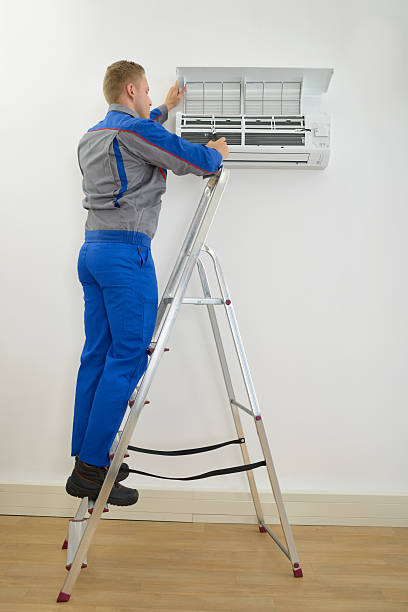 istock Male Technician Repairing Air Conditioner 470203540