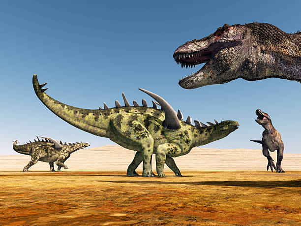 istock Gigantspinosaurus and Tyrannosaurus Rex 470204699