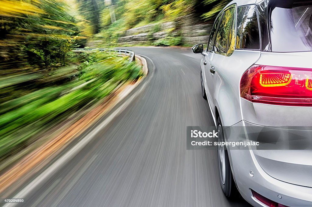 Driving a car Motion blur shot a generic car driving fast on the road Car Stock Photo