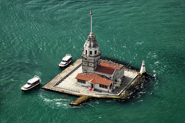 Maiden's Tower The Maiden's Tower, also known as Leander's Tower since the medieval Byzantine period, is a tower lying on a small islet located at the southern entrance of the Bosphorus strait 200 m from the coast of Üsküdar in Istanbul, Turkey. maidens tower turkey photos stock pictures, royalty-free photos & images