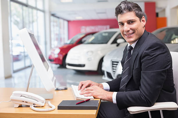 istock Smiling businessman typing on laptop 470205222