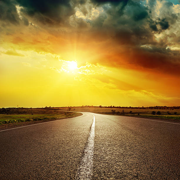 istock central white line on asphalt road and dramatic sunset 470205438