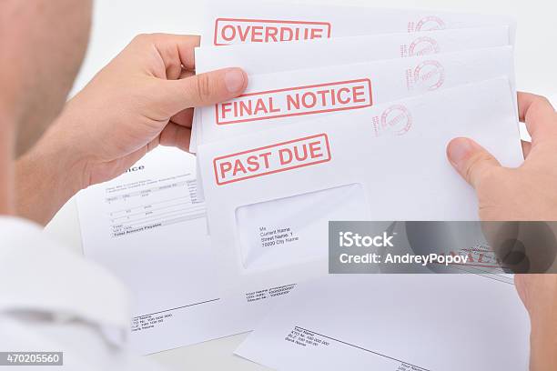 Man Holding Legal Notices Stock Photo - Download Image Now - Close To, Finance, 2015