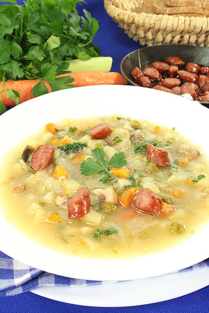istock Hearty cabbage soup with Mettwurst sausage 470205764