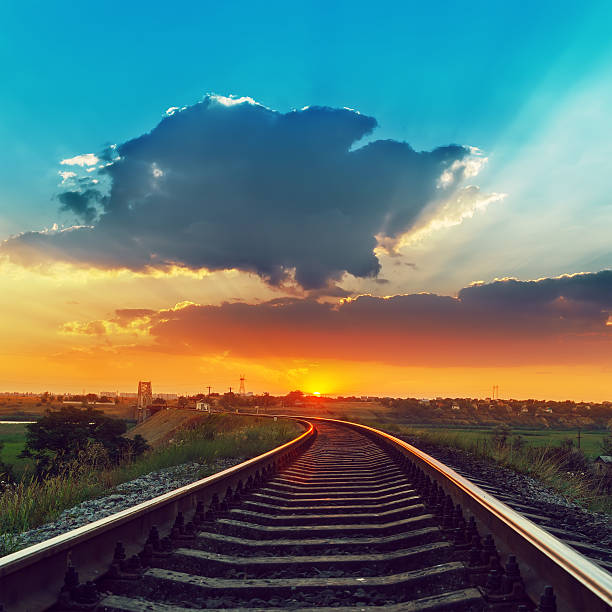 istock railway to horizon in sunset with low clouds 470206848