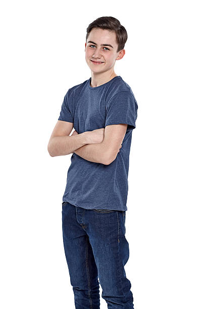 istock Cute young boy posing with his arms crossed on white 470206916