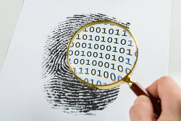 istock Hand With Magnifying Glass Over A Finger Print 470209360