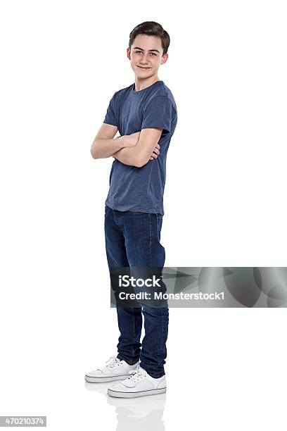 Smart Young Boy Posing For Camera Stock Photo - Download Image Now - White Background, Teenage Boys, Teenager