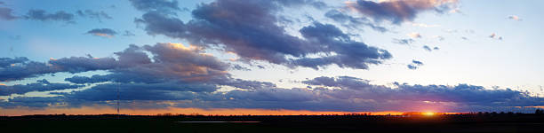istock Sunset panorama on field with Sun and clouds 470214418