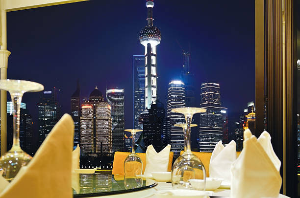 Enjoy the night view of Shanghai, at dinner time.http://www.istockphoto.com/file_thumbview_approve.php?size=2&id=29215836