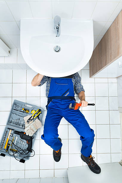 istock Plumber Repairing Sink In Bathroom 470215640
