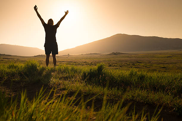 istock Arms Raised With Smart Phone in Hand 470215886