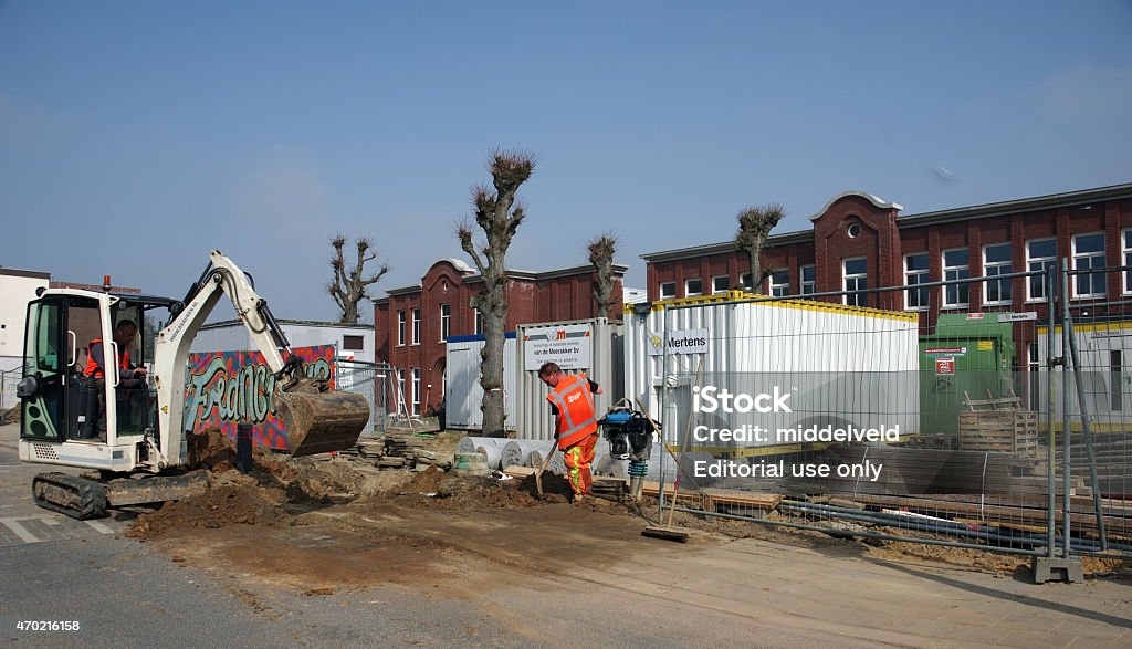 Recontruction of the sewage system Brunssum, the Netherlands - April 16, 2015 : Contractor workers are busy with the reconstruction of the main sewage system. The workers making good progress and will finish the job the same day. Pipeline Stock Photo