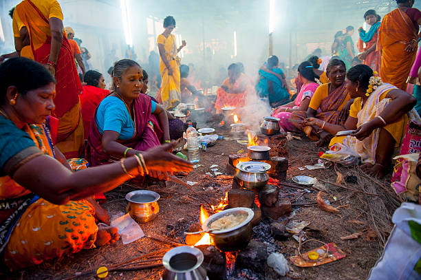Local women cooking together, India Mahabalipuram, India - March 14, 2014: Women are cooking together in a small village close to Mahabalipuram, during a local Hindu Festival. tamil nadu stock pictures, royalty-free photos & images