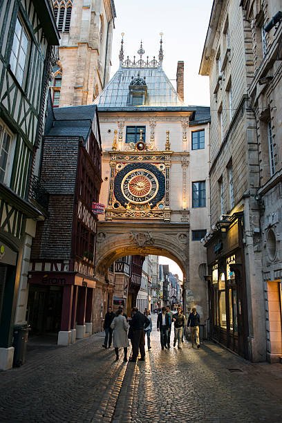 Gros Horloge clock tower in Rouen, France Rouen, France - May 14, 2014: The Gros Horloge (Great Clock) is a 16th-century timepiece in the heart of Rouen, France. rue du gros horloge photos stock pictures, royalty-free photos & images