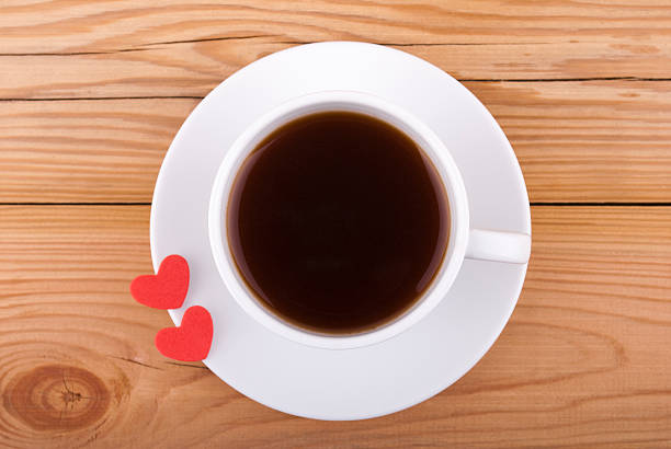 istock Cup of coffee and two hearts. 470219707