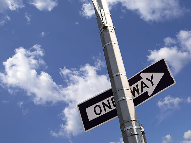 istock one way road sign on the utility pole 470222388
