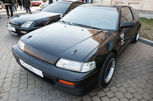 Saint-Petersburg, Russia - April 11, 2015: Black sporty Honda Civic CRX stands parked on the city street