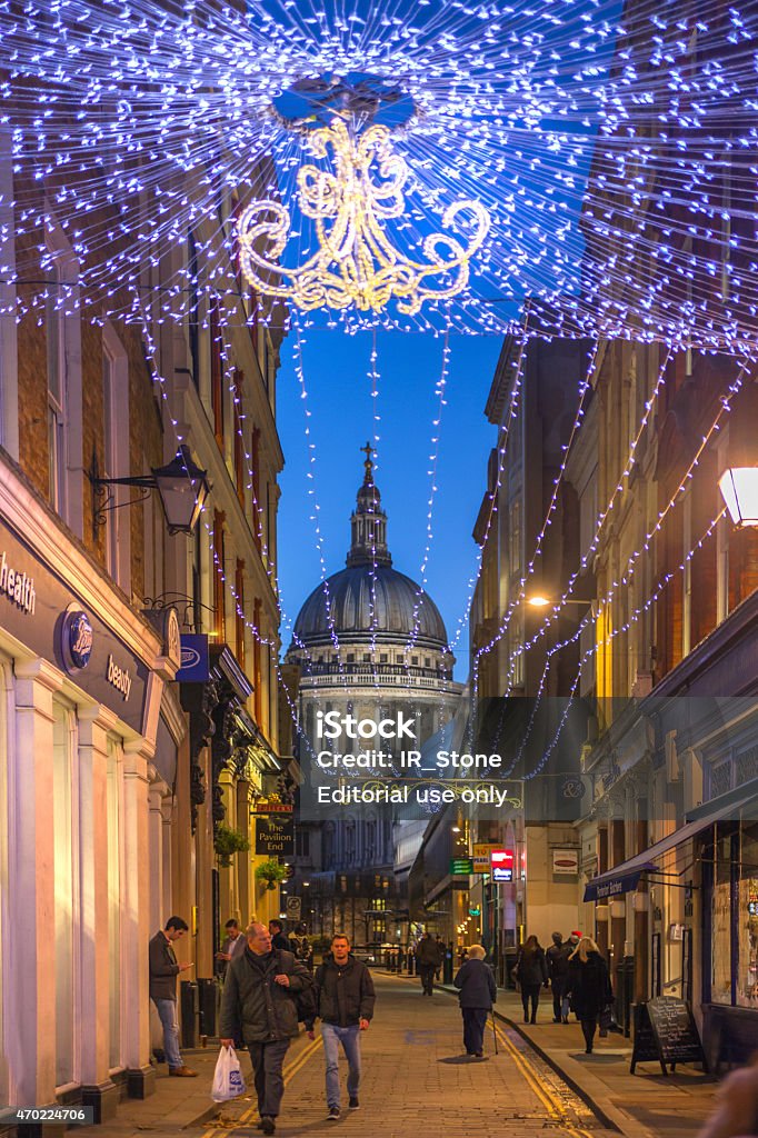 City of London. St. Paul cathedral in dusk. London, UK  - December 19, 2014: City of London. St. Paul cathedral in dusk and people walking by the old street 2015 Stock Photo