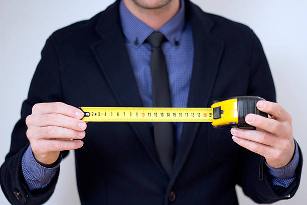 istock Business man with measuring tape 470225363