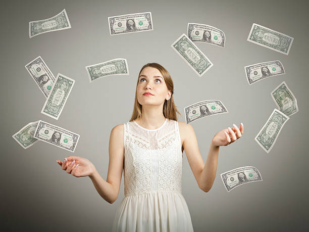 istock Girl in white and dollars. 470226446