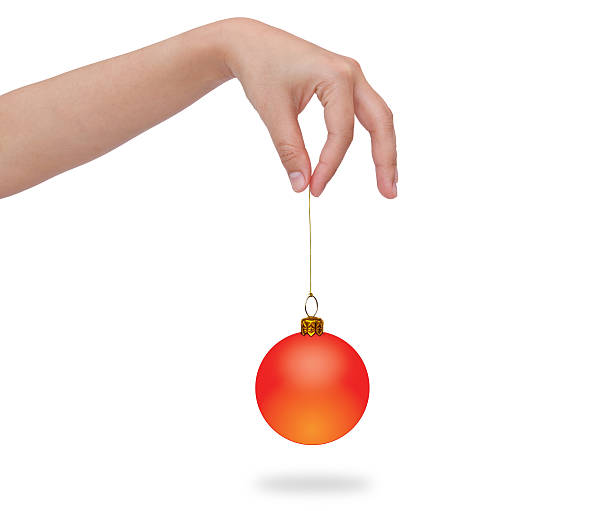istock Human hand holding christmas ball 470226513