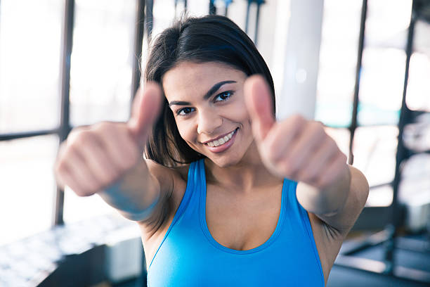 istock Happy beautiful woman showing thumb up 470227452