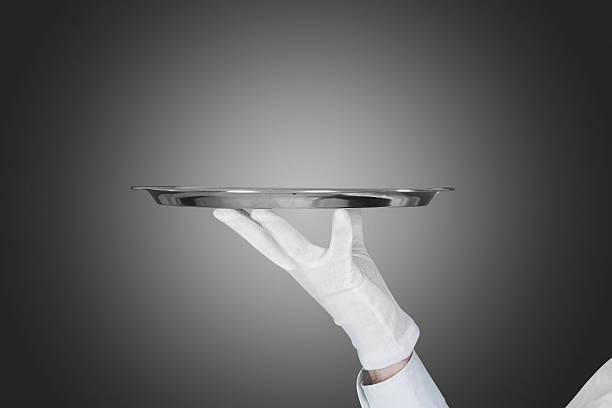 istock Waiter's Hand Holding Tray Over Gray Background 470227510