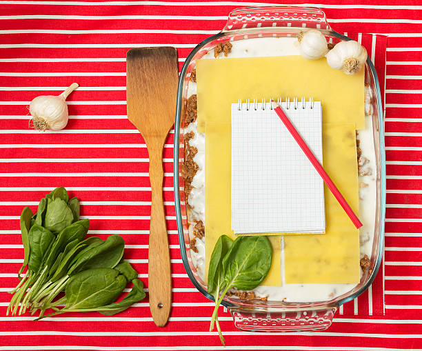 Cooking lasagna Making of tasty Italian lasagna on a bright background beef pad stock pictures, royalty-free photos & images