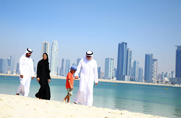 istock Arabian family walking in parbeach 470232114
