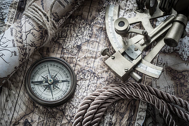 vintage marine still life vintage marine  still life with compass and old map nautical compass stock pictures, royalty-free photos & images