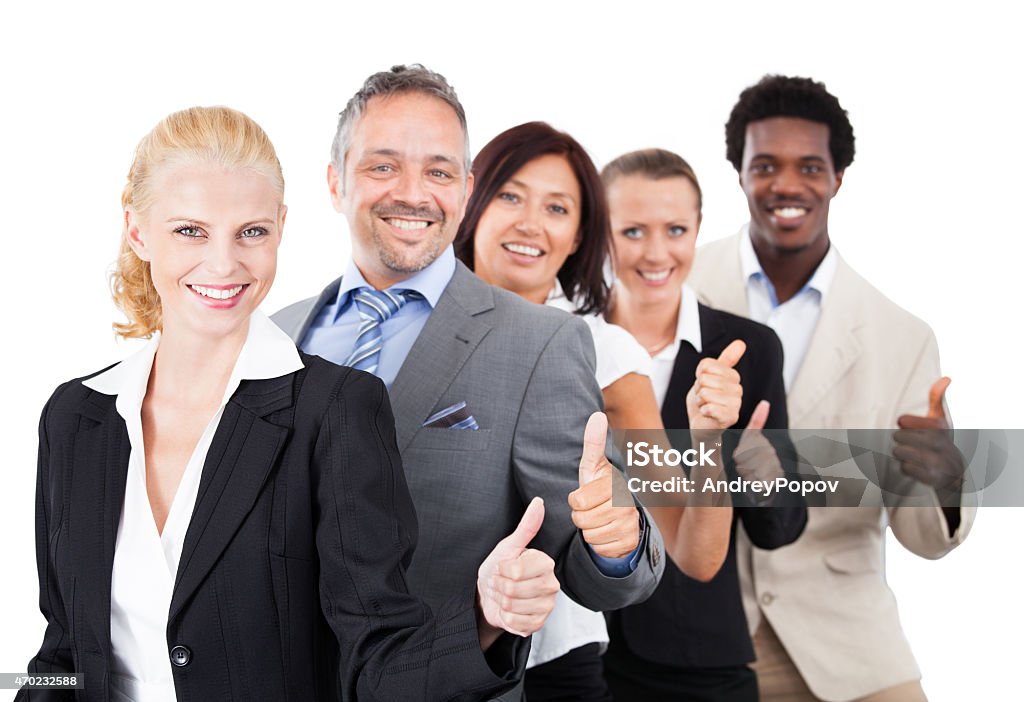 Business People Gesturing Thumbsup Over White Background Portrait of confident multiethnic business people gesturing thumbsup over white background 20-29 Years Stock Photo