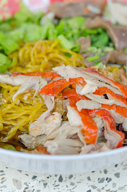 istock yellow noodles with roasted duck 470233018